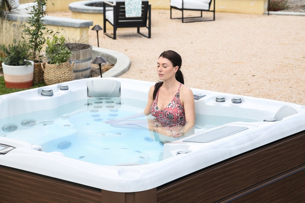 woman doing meditation in hot tube